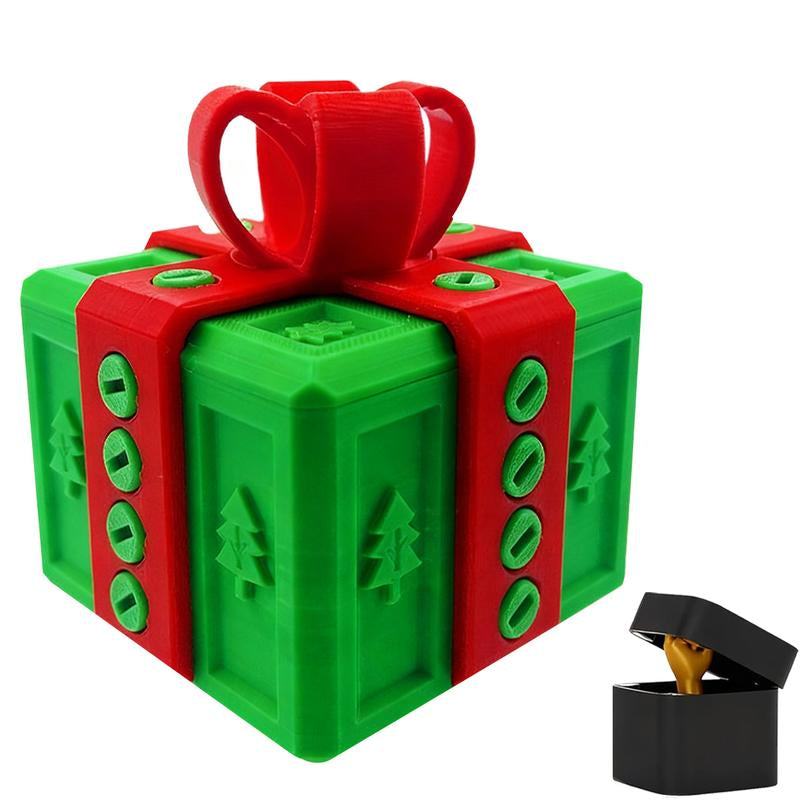 Green 3D-printed Christmas gift box with red ribbon and tree pattern, open black ring box with gold ring inside